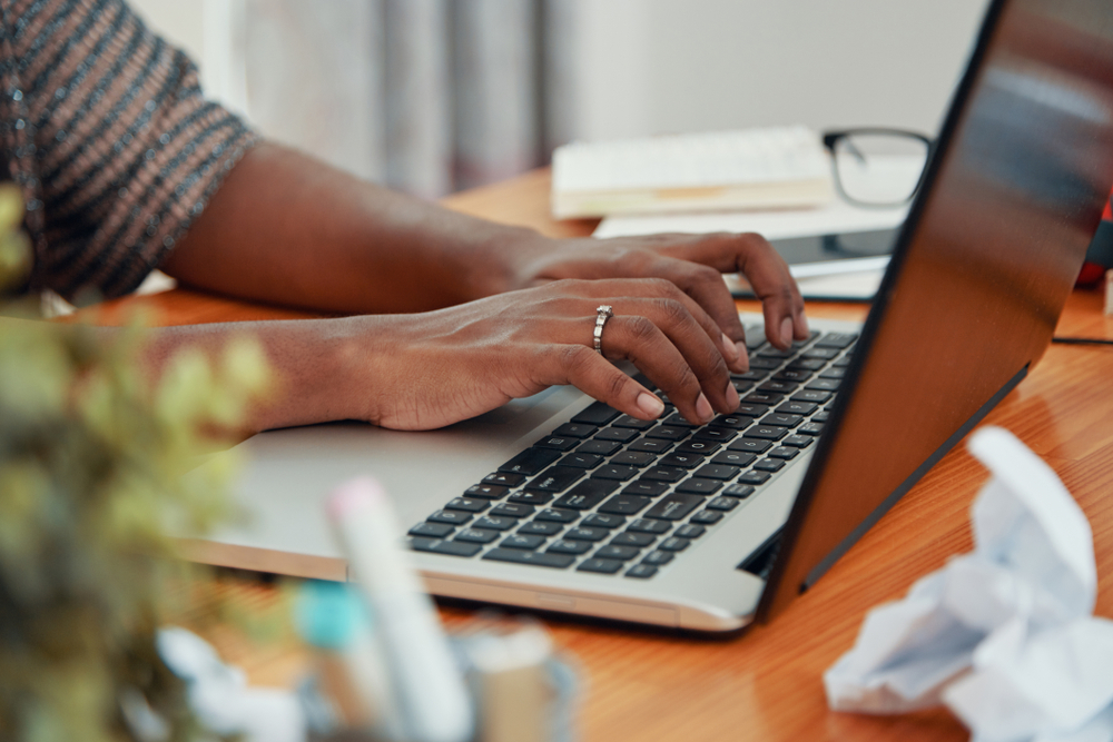 Woman typing at the computer